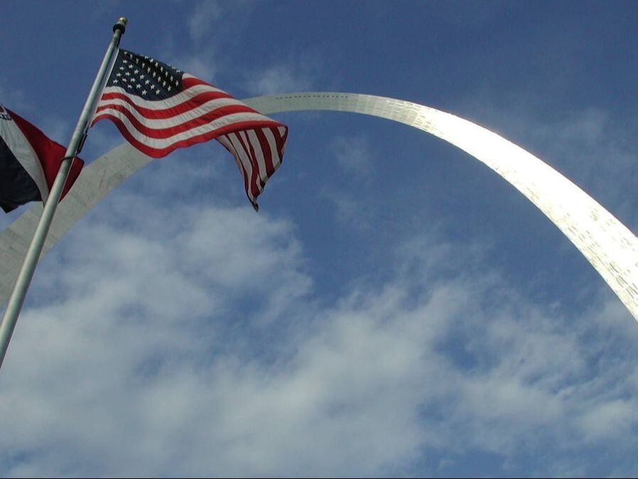 Flags flying in front of the Arch